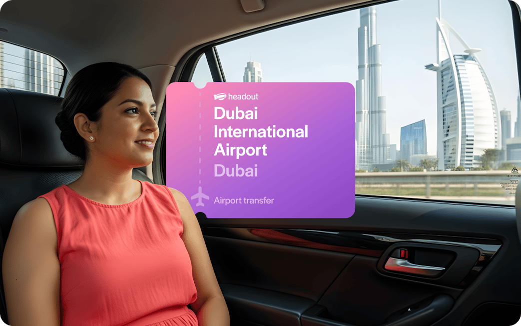 Passenger in car with view of Burj Khalifa and Burj Al Arab, Dubai airport transfer.