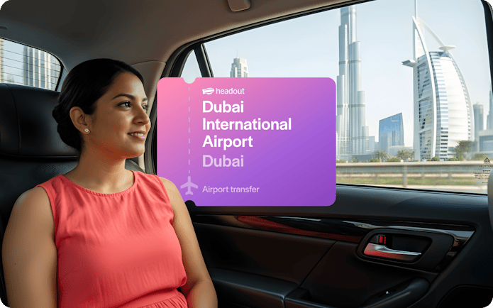 Passenger in car with view of Burj Khalifa and Burj Al Arab, Dubai airport transfer.