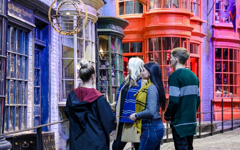 Visitors exploring Diagon Alley during a small group guided tour of Harry Potter in London.