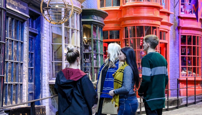 Visitors exploring Diagon Alley during a small group guided tour of Harry Potter in London.