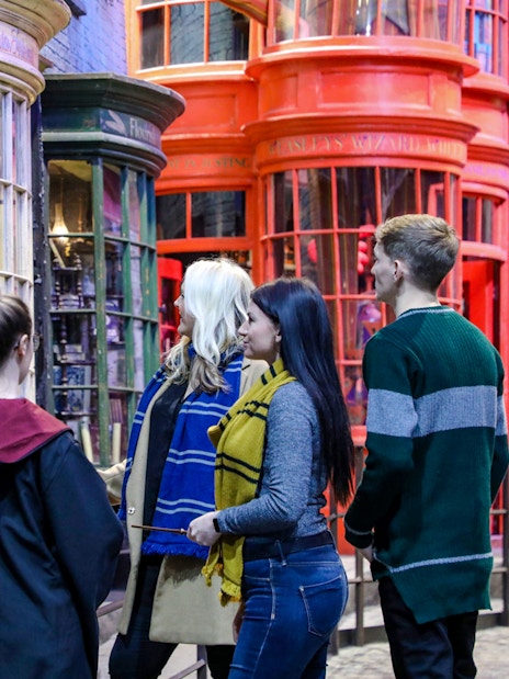 Visitors exploring Diagon Alley during a small group guided tour of Harry Potter in London.