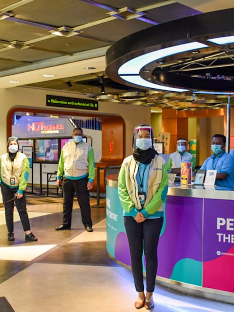 People standing at the entrance of Petrosains, The Discovery Centre in Kuala Lumpur.