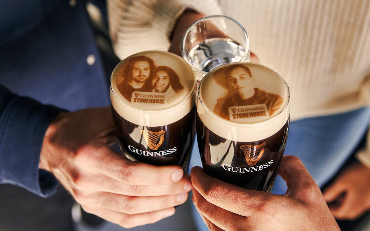 Guests enjoying personalized Stouties at Guinness Storehouse, Dublin.