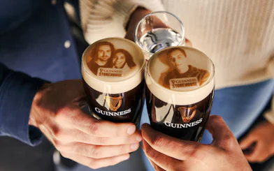 Guests enjoying personalized Stouties at Guinness Storehouse, Dublin.