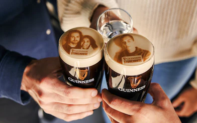 Guests enjoying personalized Stouties at Guinness Storehouse, Dublin.