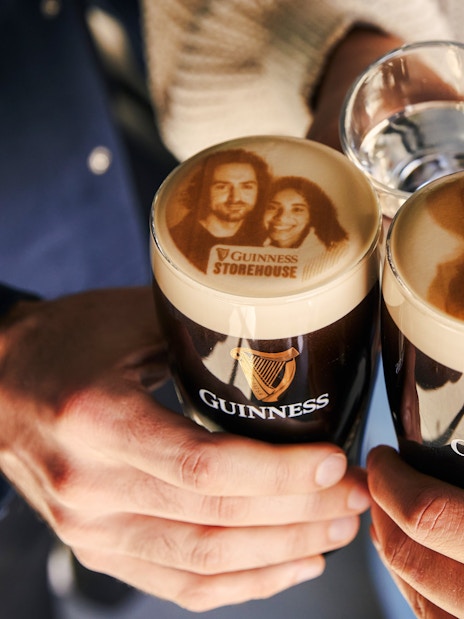 Guests enjoying personalized Stouties at Guinness Storehouse, Dublin.