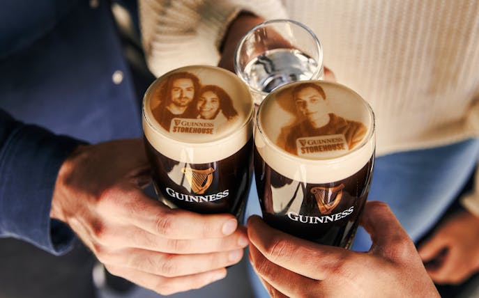 Guests enjoying personalized Stouties at Guinness Storehouse, Dublin.