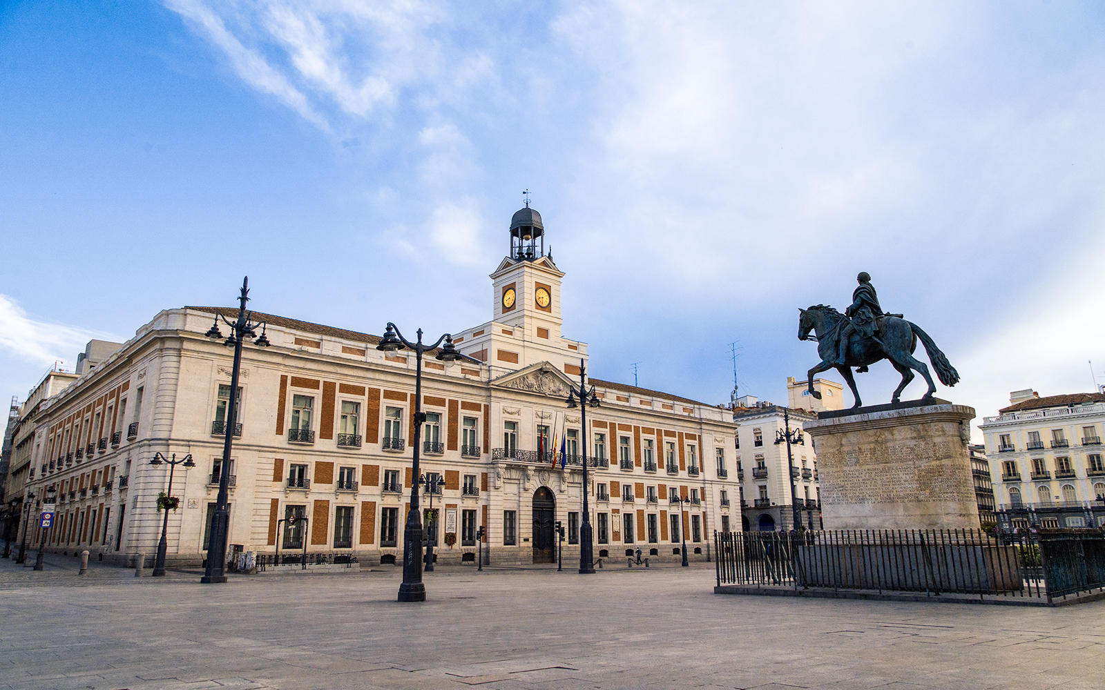 Equestrian statue and clock tower at Puerta del Sol, Madrid.