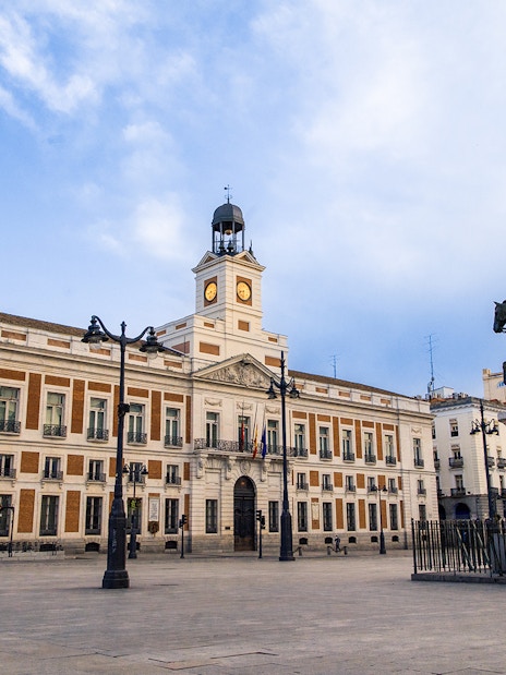 Equestrian statue and clock tower at Puerta del Sol, Madrid.
