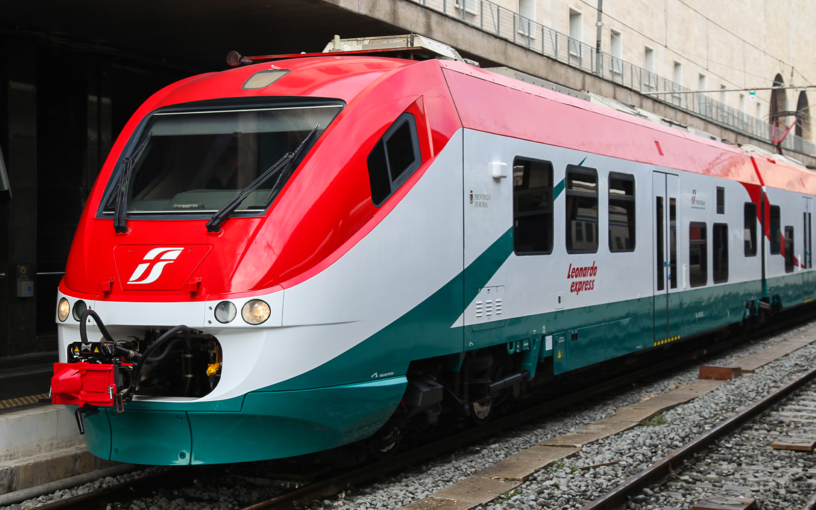 Leonardo Express train at a station platform in Rome, Italy.