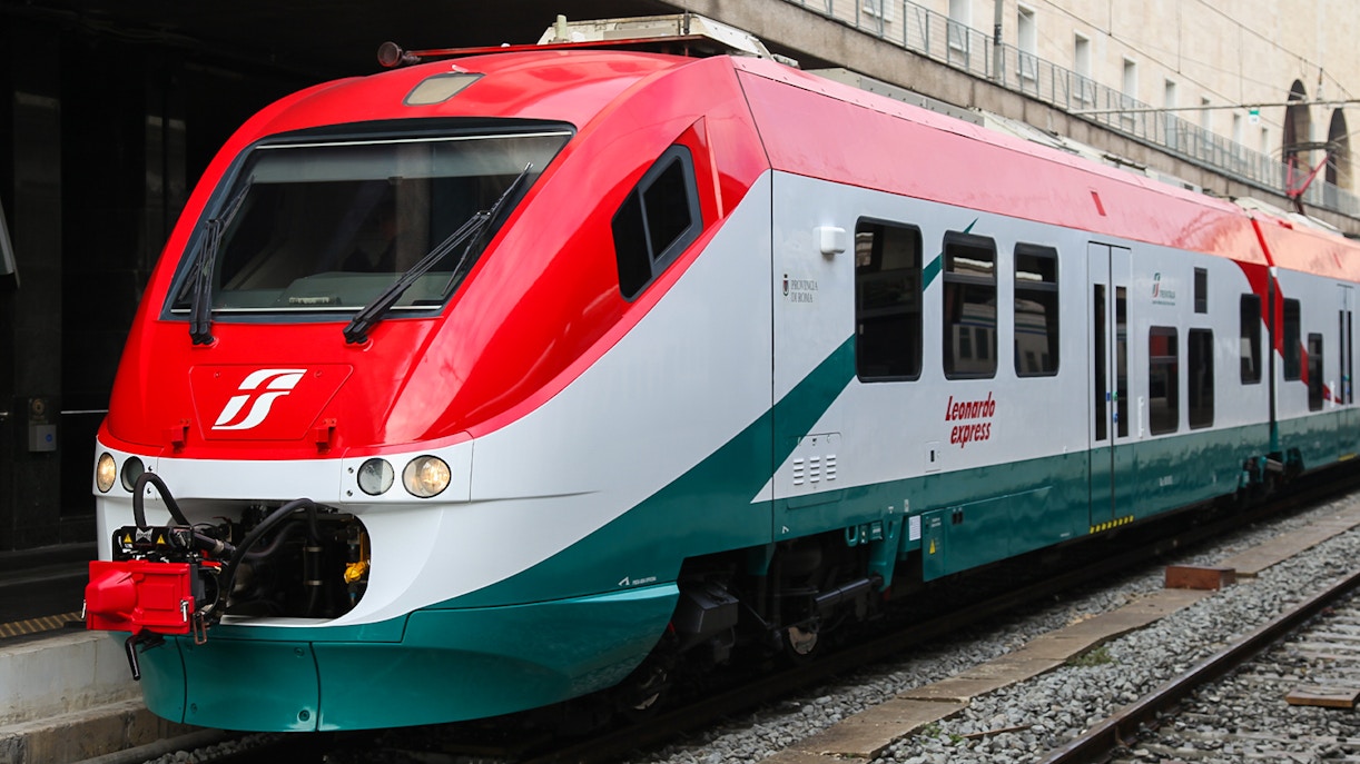 Leonardo Express train at a station platform in Rome, Italy.