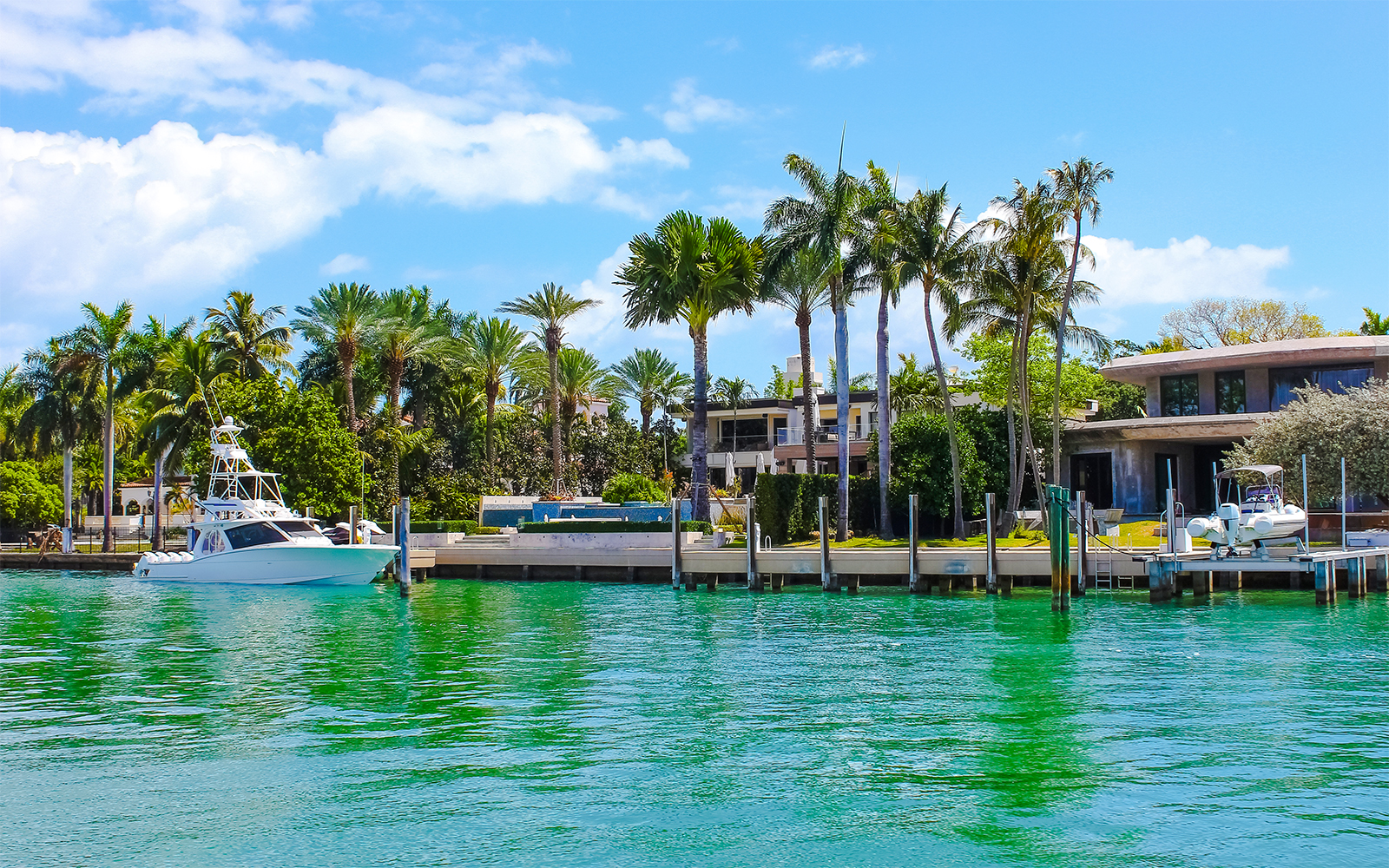 Luxurious mansion with yacht on Star Island, Miami.