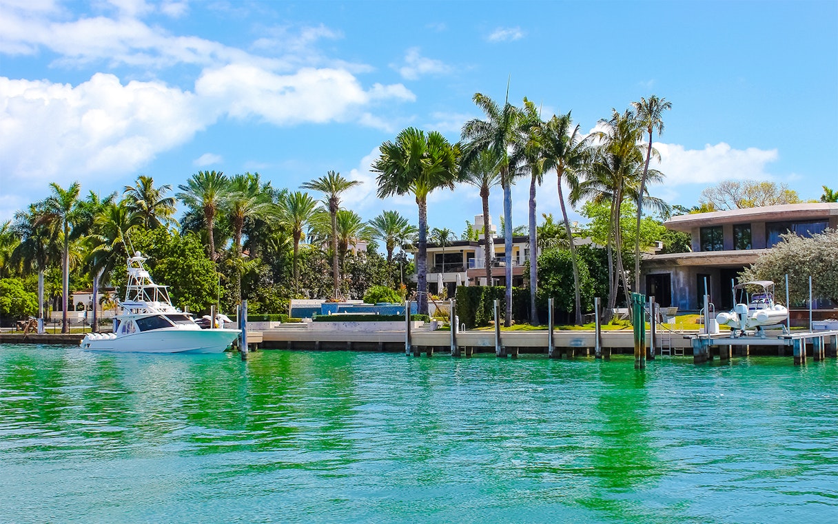 Luxurious mansion with yacht on Star Island, Miami.
