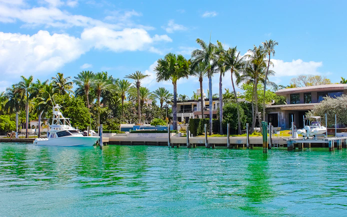 Luxurious mansion with yacht on Star Island, Miami.