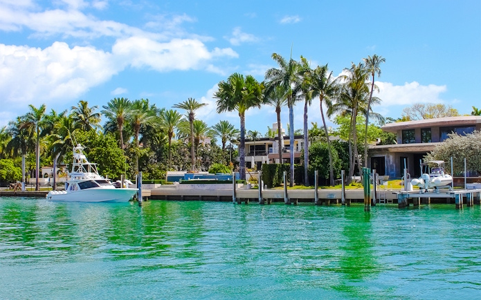 Luxurious mansion with yacht on Star Island, Miami.
