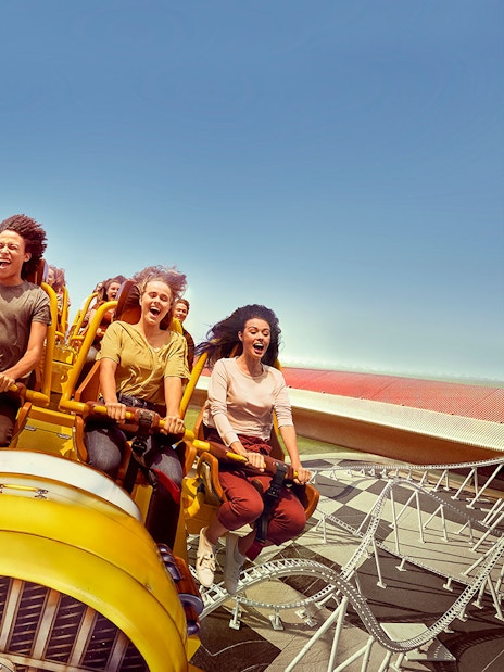 Visitors enjoying a roller coaster ride at Ferrari World Abu Dhabi.