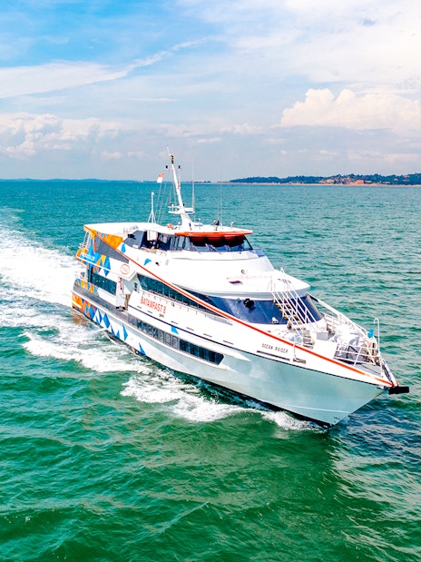 Ferry traveling from Singapore to Batam across blue ocean waters.