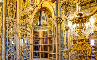 Ornate interior with gilded sculptures and intricate carvings at Bode Museum, Berlin.