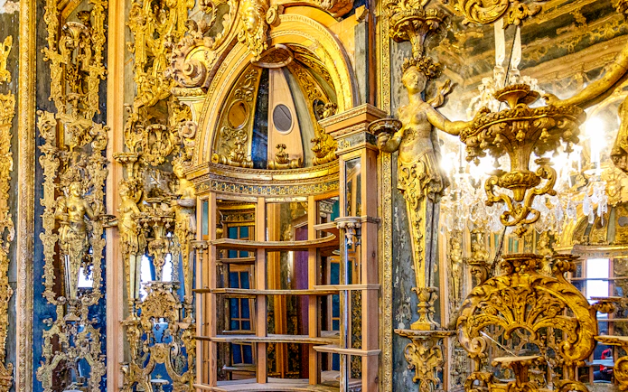 Ornate interior with gilded sculptures and intricate carvings at Bode Museum, Berlin.