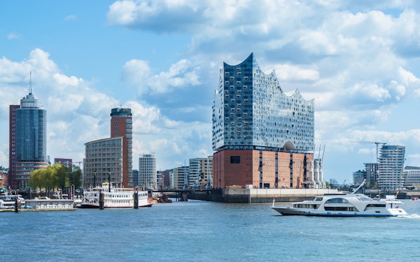 Hamburg harbor cruise with Elbphilharmonie and city skyline in the background.
