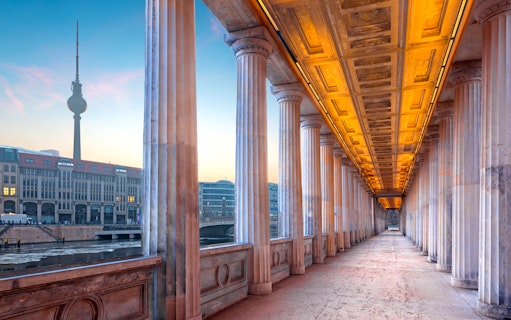 Colonnade walkway at Alte Nationalgalerie, Berlin, with TV Tower in the background.