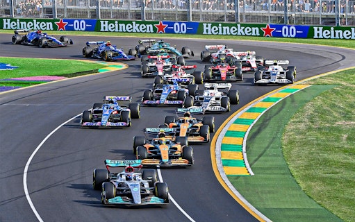 Formula 1 cars racing on track at Australia Grand Prix.