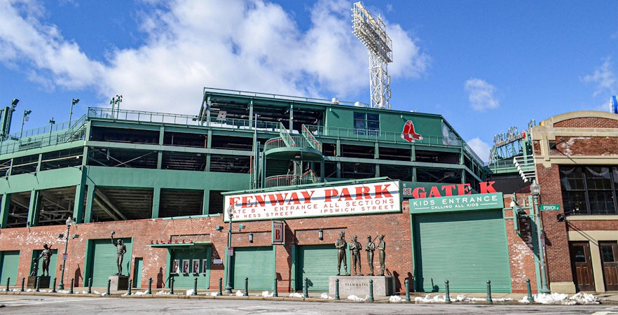 Fenway Park entrance with statues and signage, Boston.