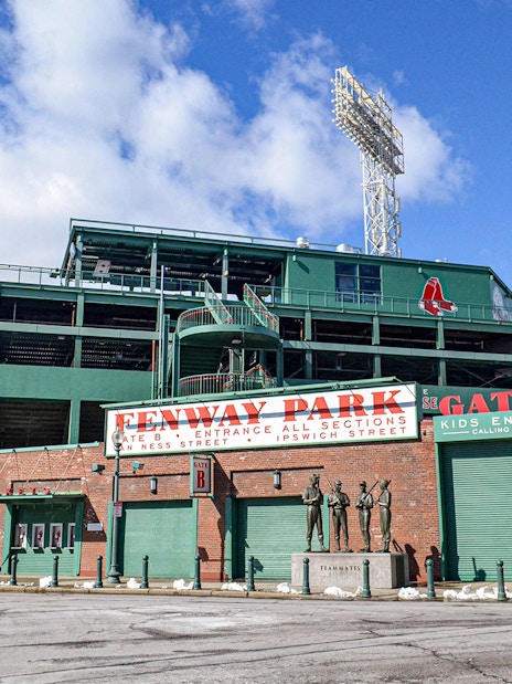 Fenway Park entrance with statues and signage, Boston.