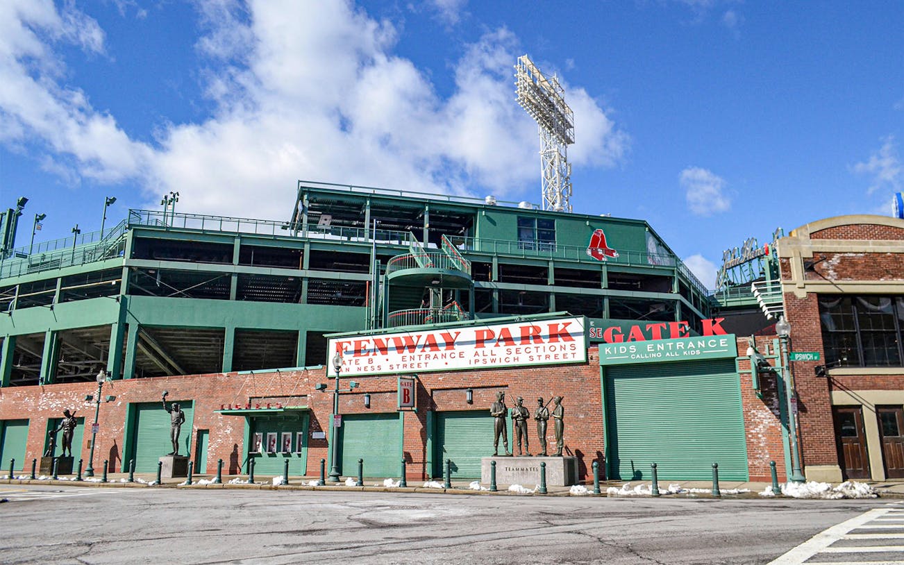 Fenway Park entrance with statues and signage, Boston.