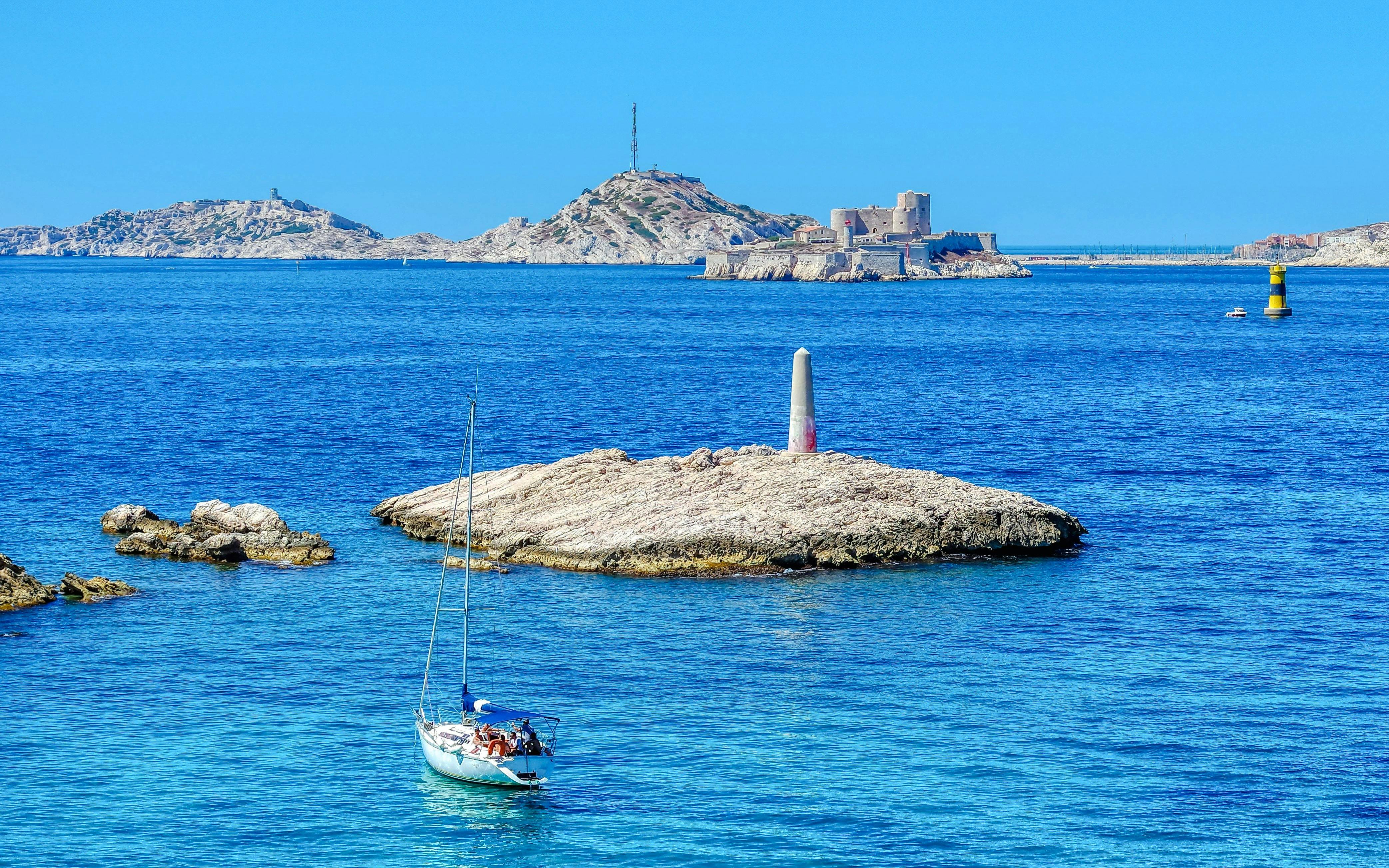 Sailboat near Frioul Archipelago with Châteaux d’If in the background, Marseille.