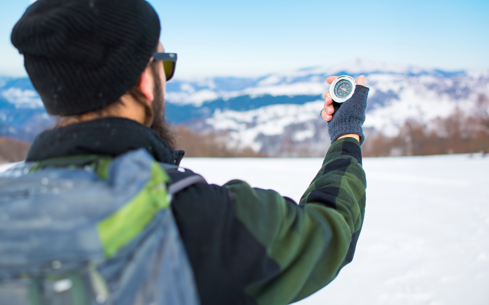 Northern Lights over snowy landscape during small group photography tour.