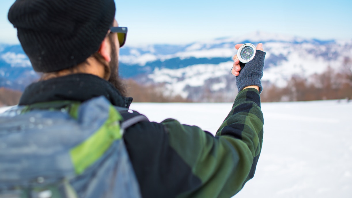 Northern Lights over snowy landscape during small group photography tour.