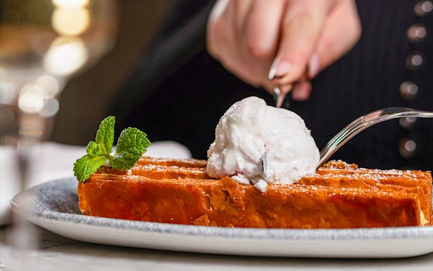 Waffle with ice cream and mint garnish at Flora Danica, Champs Elysées, Paris.