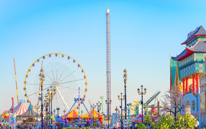 Ferris wheel and colorful attractions at Global Village Dubai.