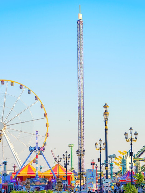 Ferris wheel and colorful attractions at Global Village Dubai.