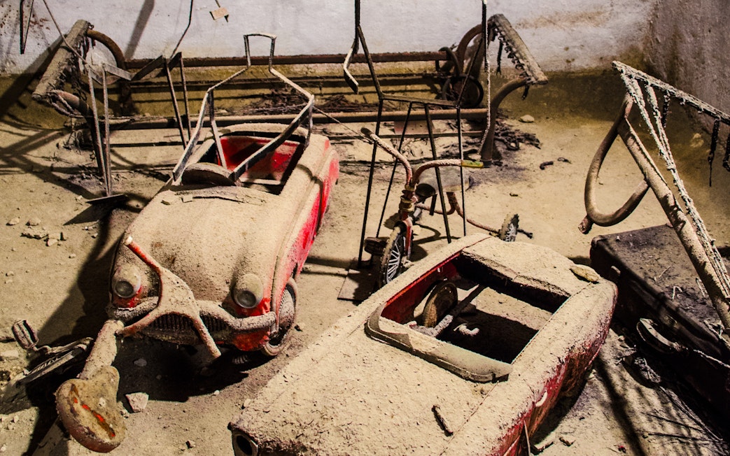 Old cars covered in dust in Naples Underground.