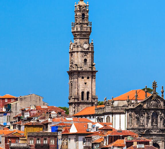 Clerigos Tower in Porto with cityscape view in the background.