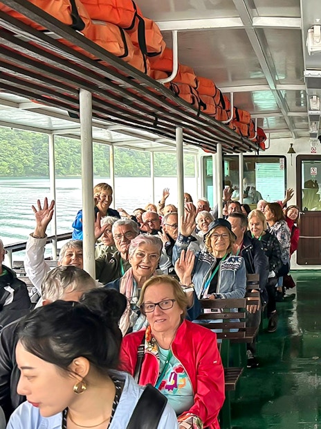 Guests on a boat during Plitvice Lakes Tour, Croatia, enjoying the scenic ride.