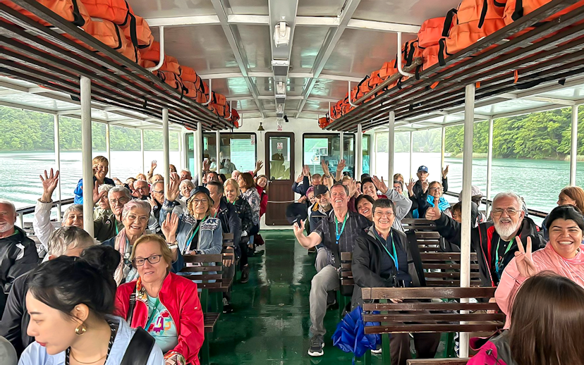 Guests on a boat during Plitvice Lakes Tour, Croatia, enjoying the scenic ride.
