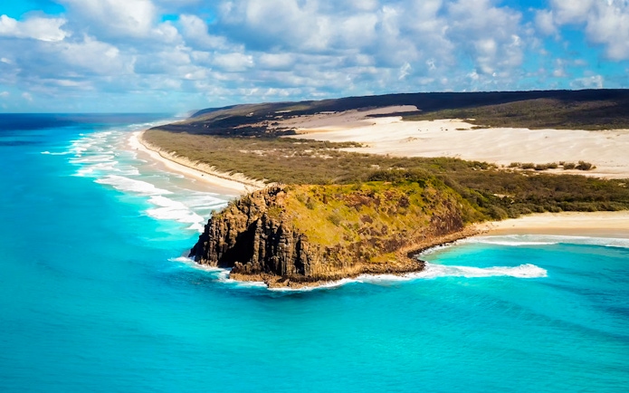 Aerial view of Fraser Island's coastline with turquoise waters and sandy beaches, K'gari.
