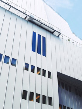 Whitney Museum modern facade with vertical windows in New York City.