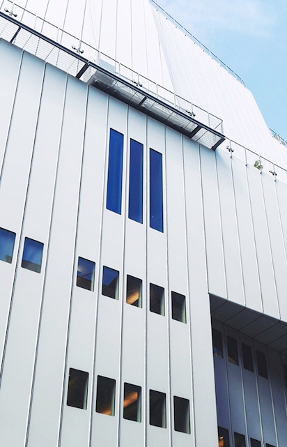 Whitney Museum modern facade with vertical windows in New York City.