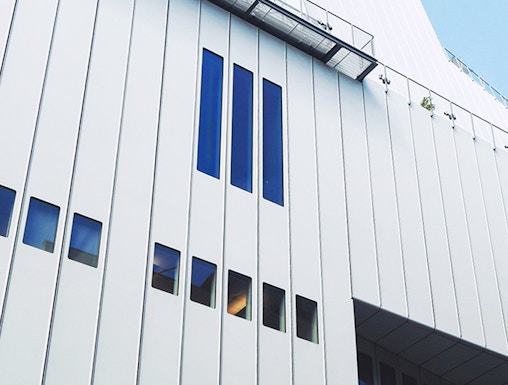 Whitney Museum modern facade with vertical windows in New York City.