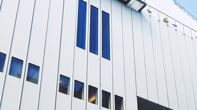 Whitney Museum modern facade with vertical windows in New York City.
