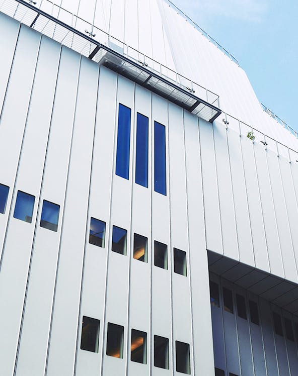 Whitney Museum modern facade with vertical windows in New York City.