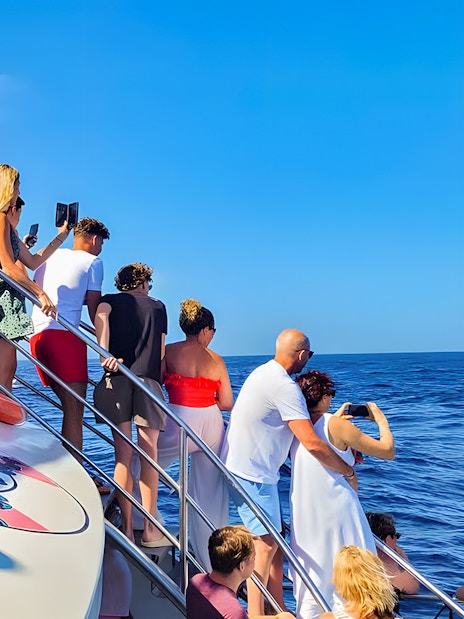 Tourists on a Gran Canaria cruise boat watching for dolphins.