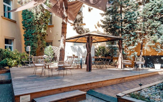 Courtyard seating area inside Minorite monastery of St James, Prague.