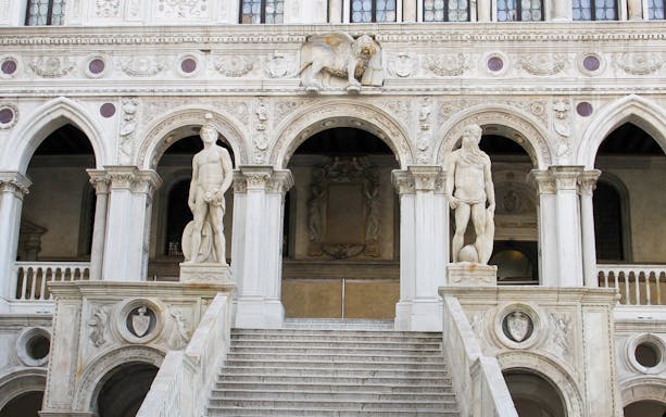 Staircase with statues at Doge's Palace, Venice, Italy.