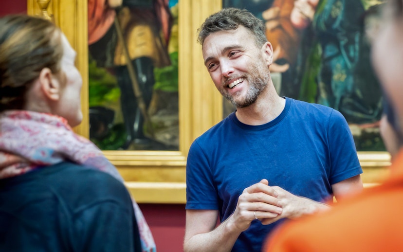 Guide explaining artwork during National Gallery tour.
