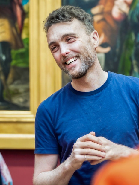 Guide explaining artwork during National Gallery tour.